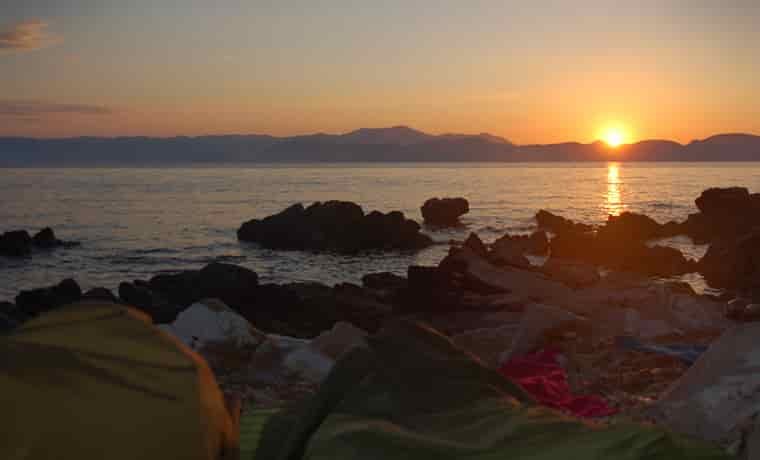 Sunrise over sea and mountains