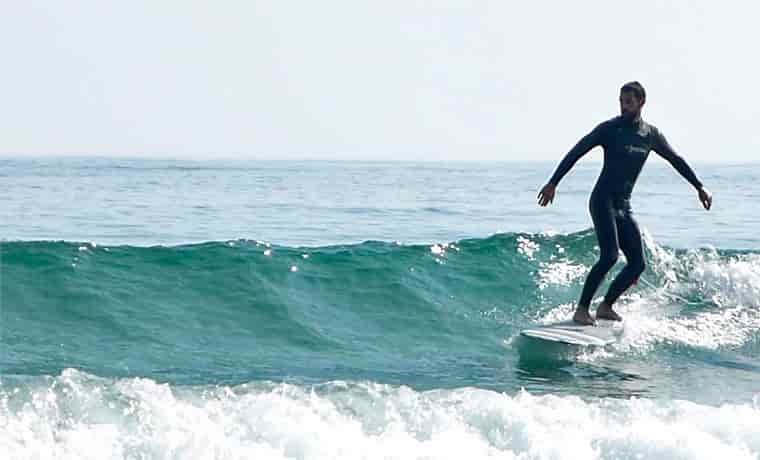 Man surfing on a long board