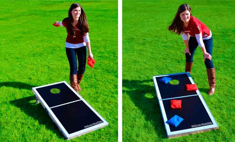 Lady playing cornhole