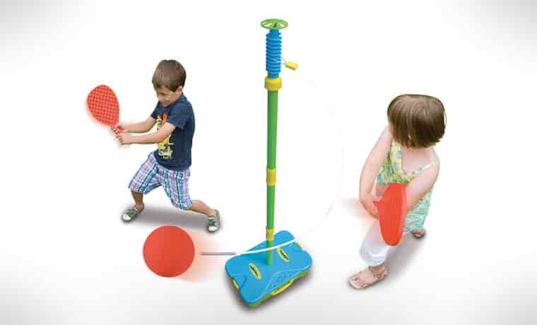 Two kids playing swingball