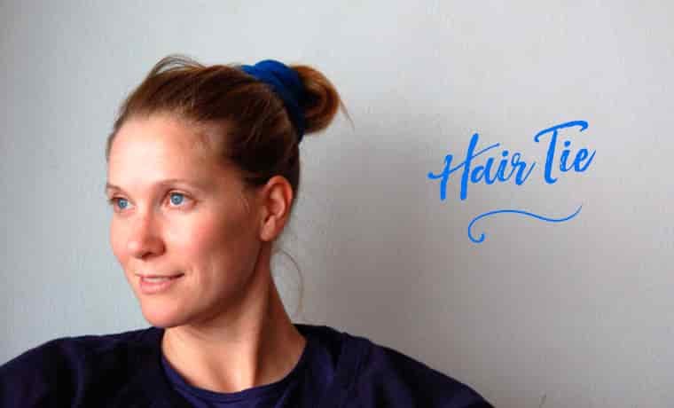 Woman wearing a Buff as a hair tie