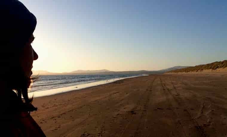Silhouette of woman on beach