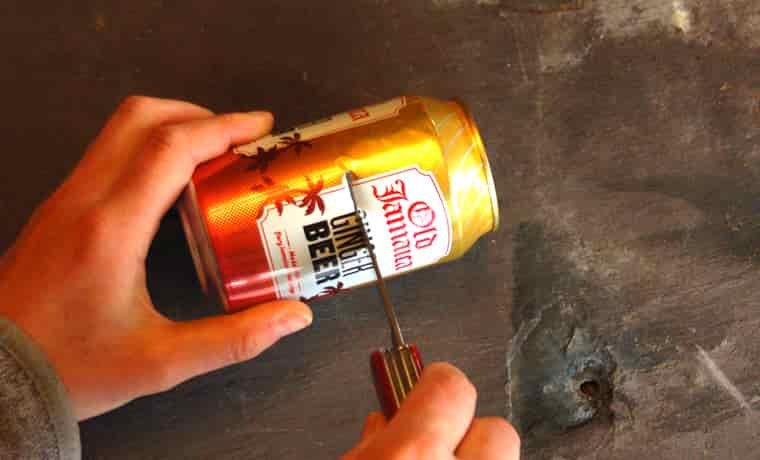 Cutting a soda can in half