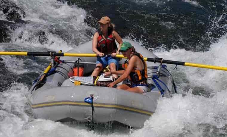 Extreme ironing white water rafters