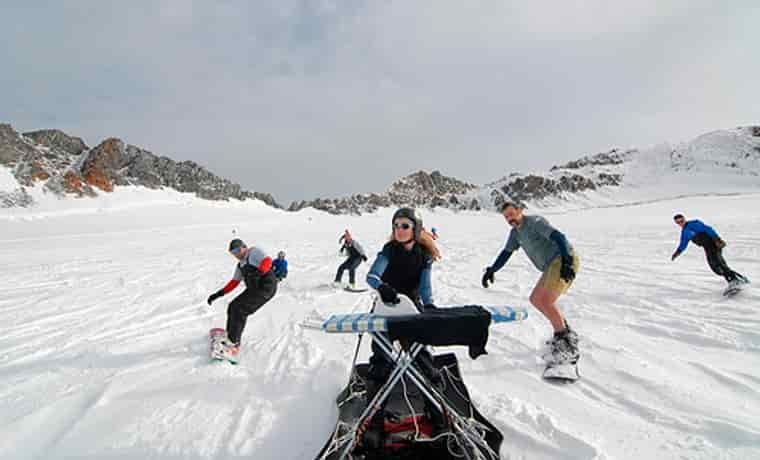 Extreme ironing snowboarders