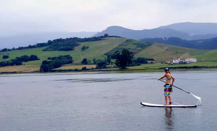 Paddle boarder on river