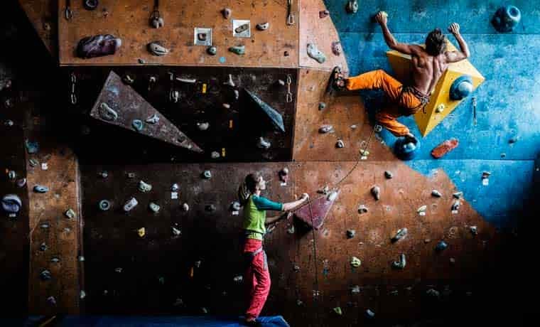 Man climbing at indoor climbing gym