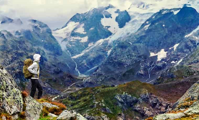 Woman hiking in snowy mountains