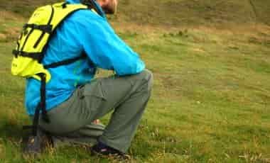 Kneeling in hiking pants