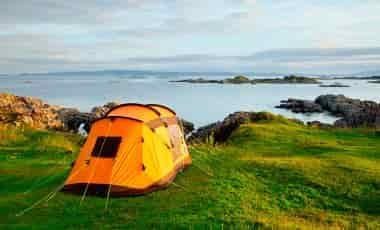 Large multi room tent overlooking lake