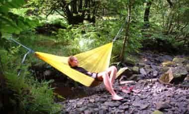 Woman sitting in hammock