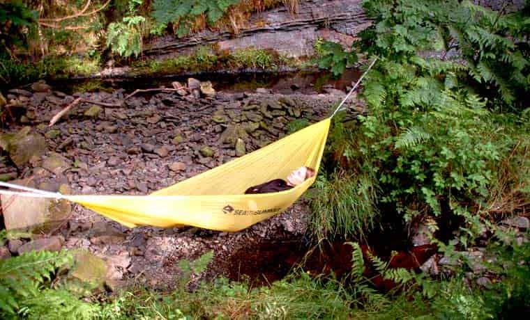 Woman sleeping in hammock