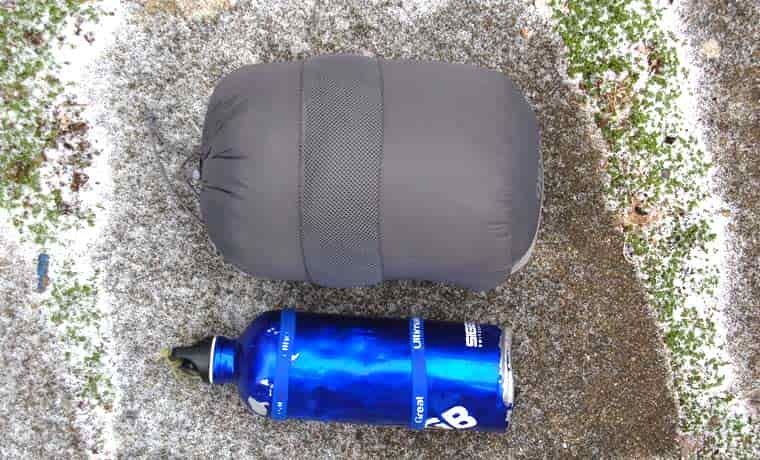 Packed jacket next to bottle