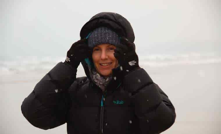 Standing on cliffs in snowy conditions