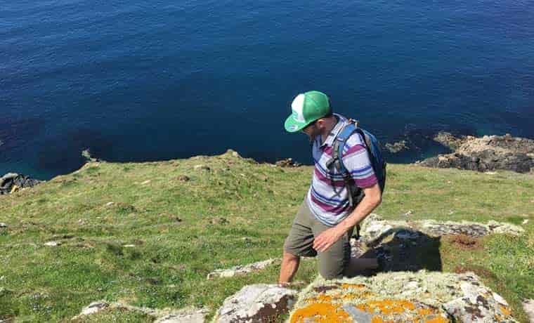Man hiking by the sea