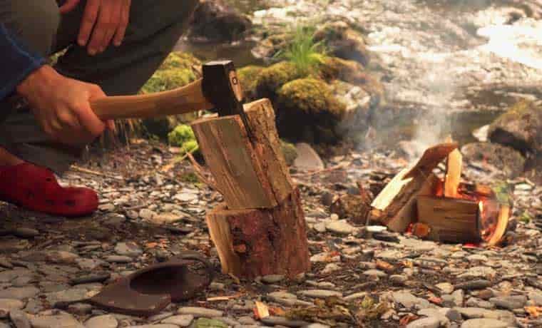 Cutting wood with axe