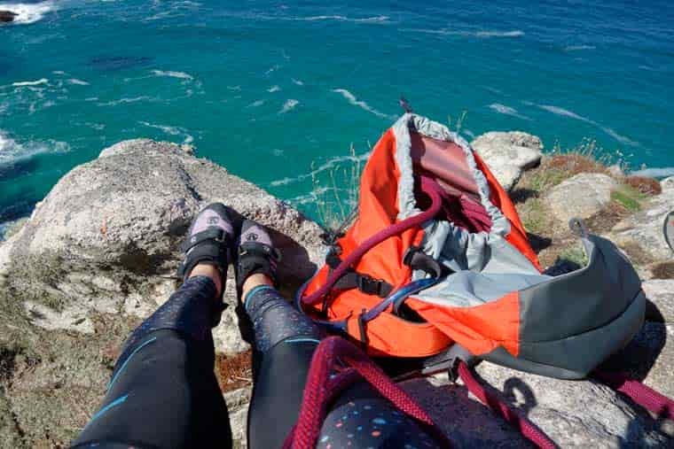 Backpack and rope on sea cliffs