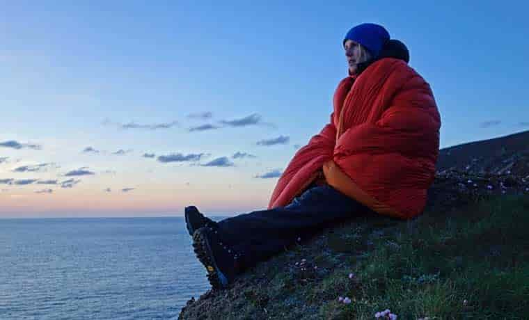 Woman wrapped in a camping quilt