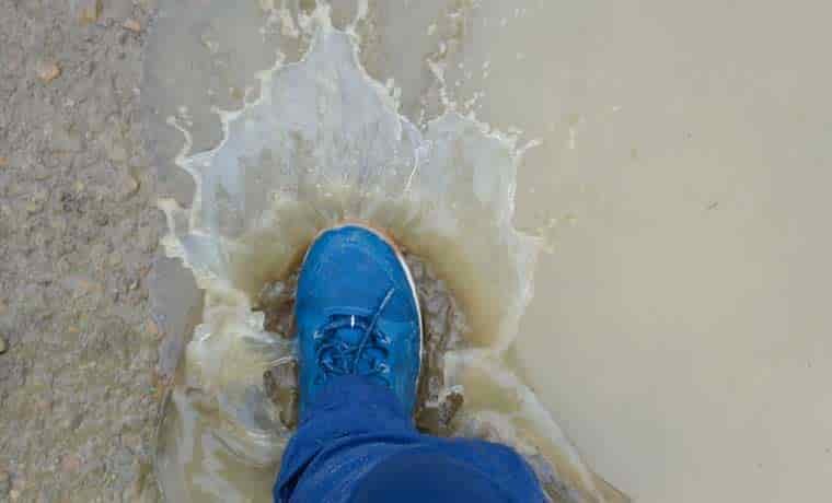 Stepping in puddle