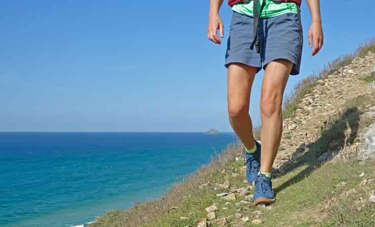 Woman hiking by the sea