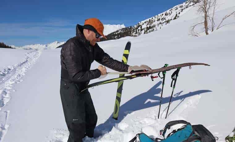 Man putting skins on splitboard