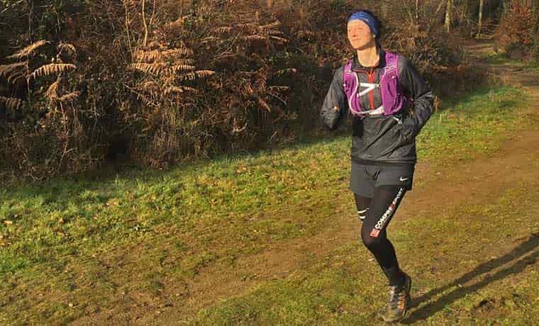 Woman running in hydration vest