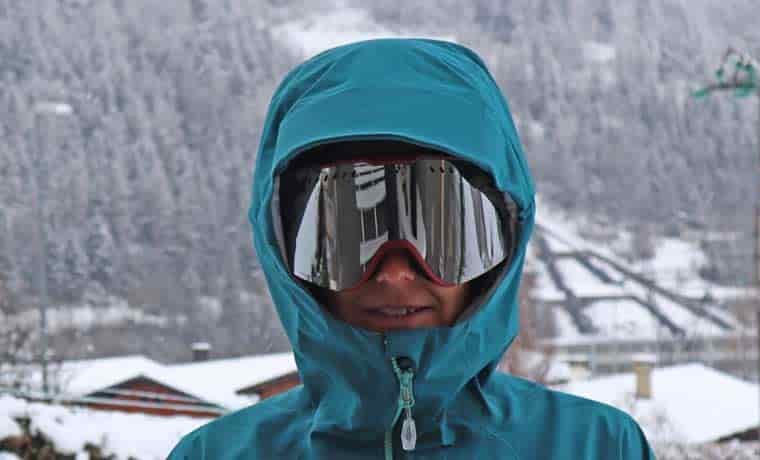 Hood up with googles on in snow