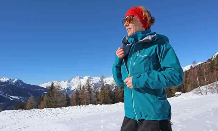 Woman wearing jacket in snow