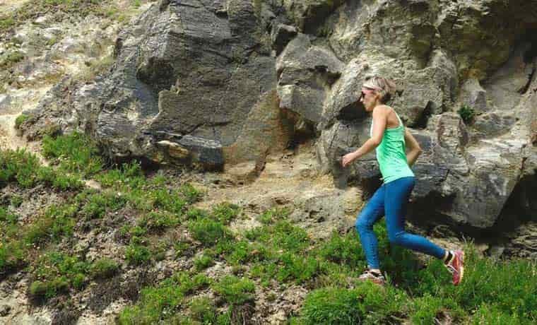 woman trail running in leggings