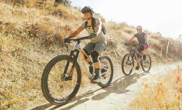 Couple mountain biking