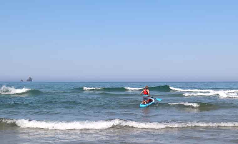 Paddling out through waves
