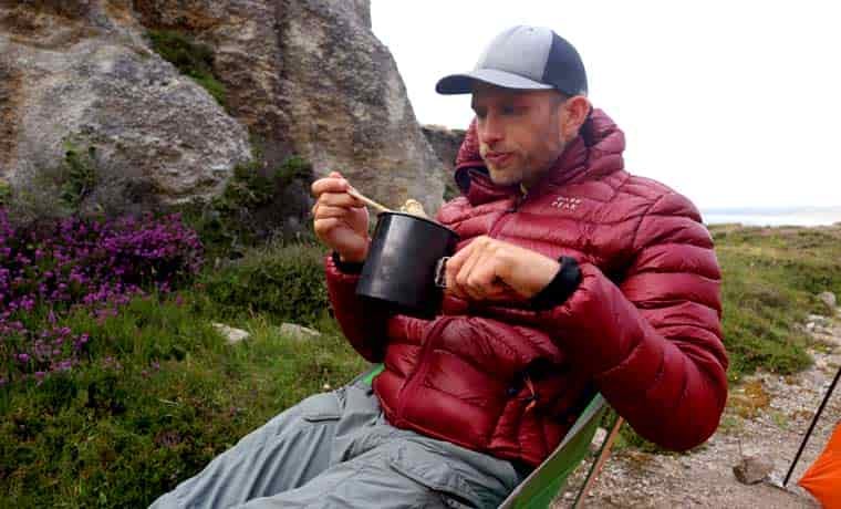 Man eating camping food