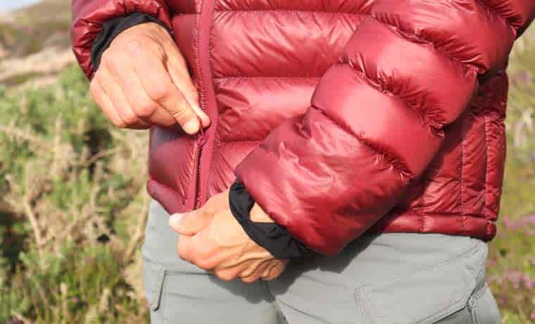 Man zipping up jacket