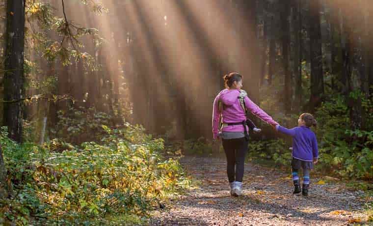 Kid walking with mum