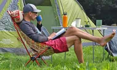Man sitting on Sunset Camping chair