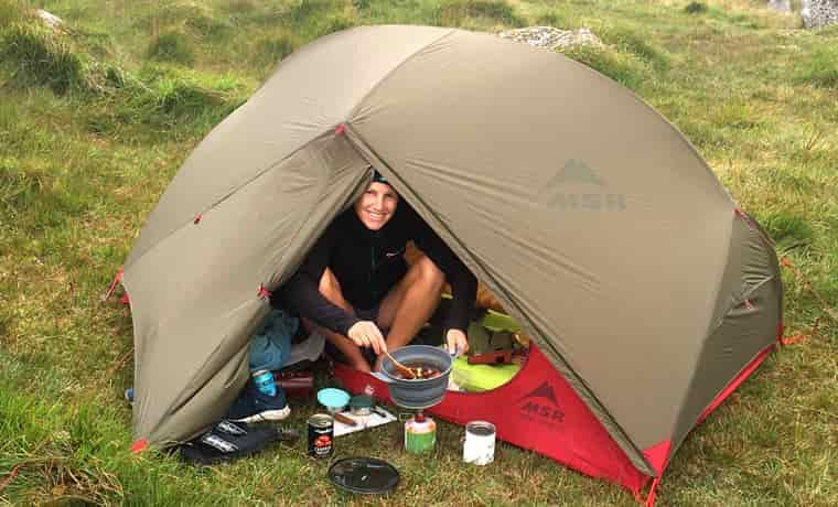 Woman in MSR Hubba Hubba Tent