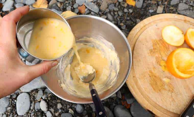 Adding egg mix to cake batter