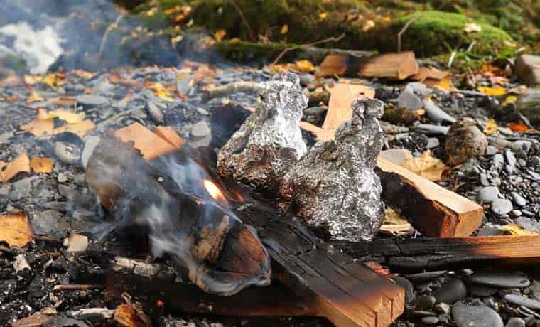 Cakes in foil on campfire