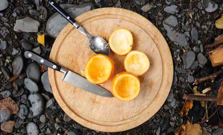 Cut oranges on board
