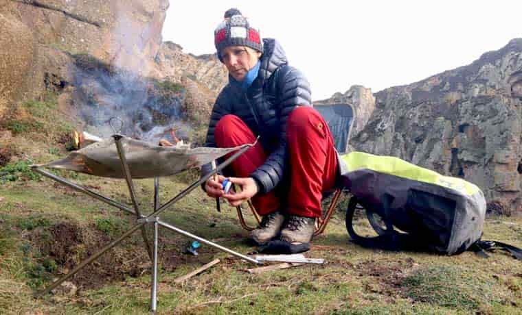 Woman lighting a fire
