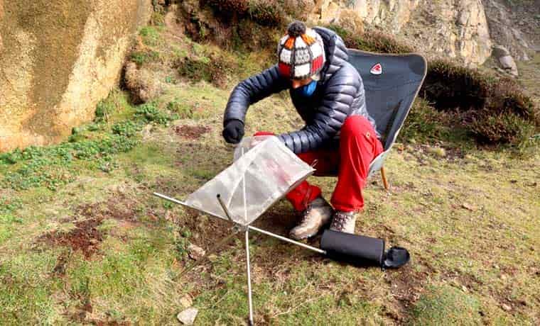 Woman setting up a portable fire pit