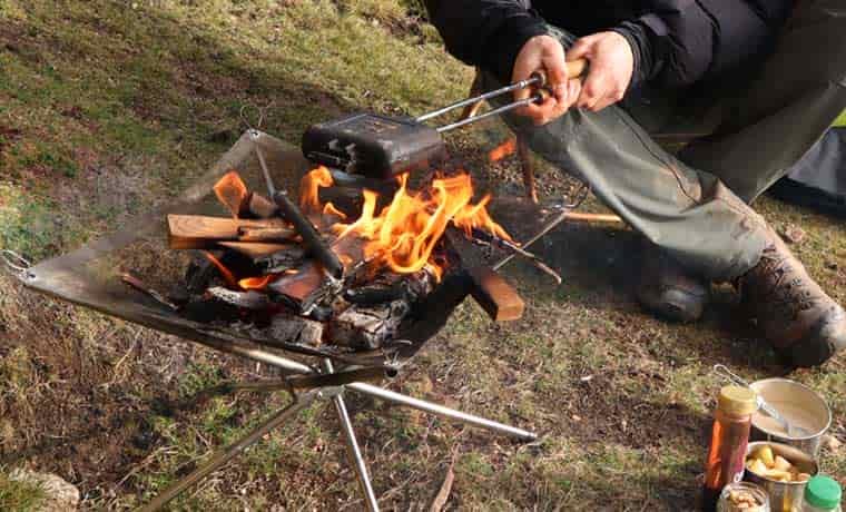 Pie iron over campfire