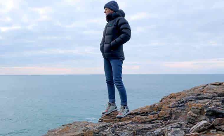 Woman standing by the sea