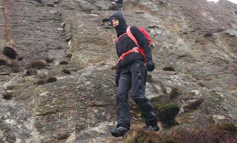 Woman hiking along rocks