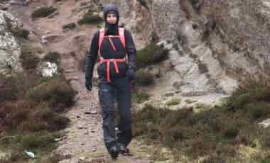 Woman hiking in Houdini WP Pants