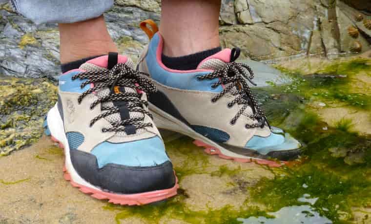 Standing in a puddle in running shoes