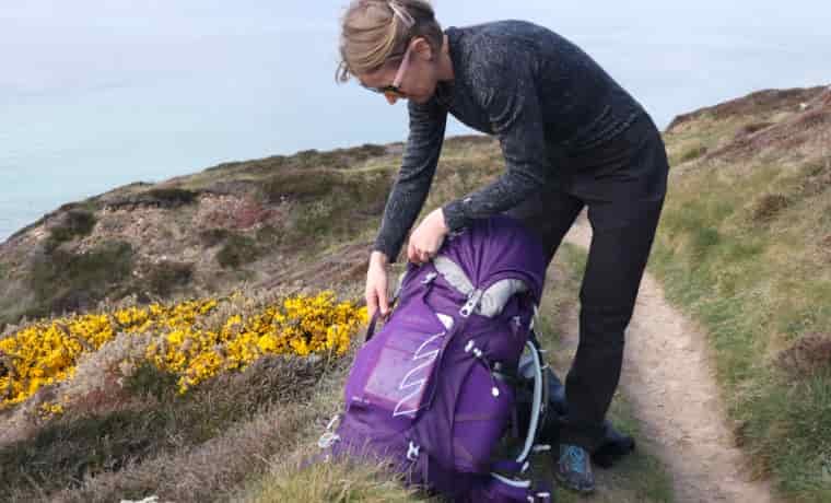 Woman packing backpack