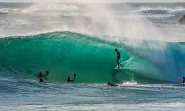 Person being filmed surfing