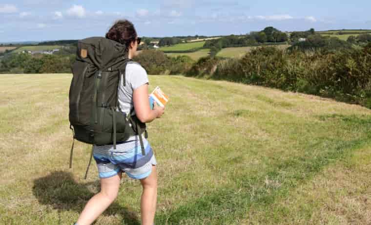 Woman hiking in Fjallraven Abisko Backpack