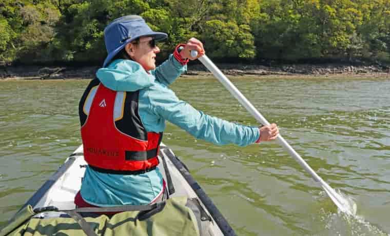 Woman paddling a canoe